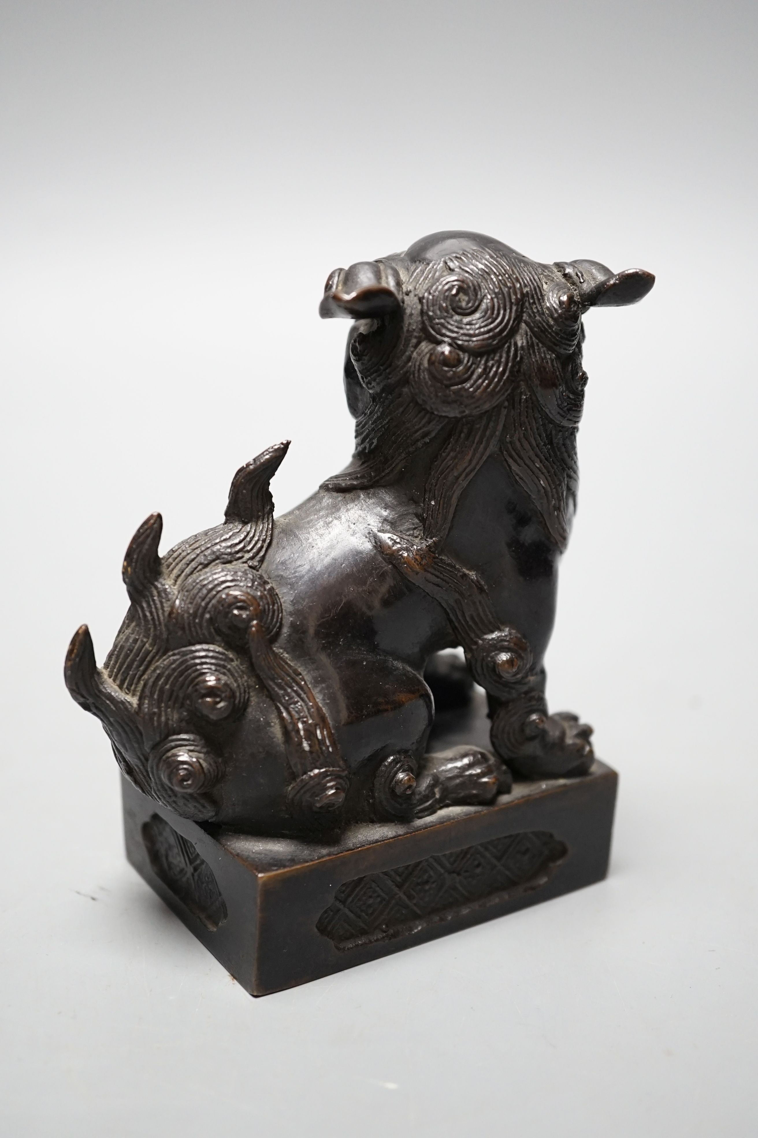 A Japanese bronze Buddhistic lion, Nogara, Noburu mark to base, 11cm